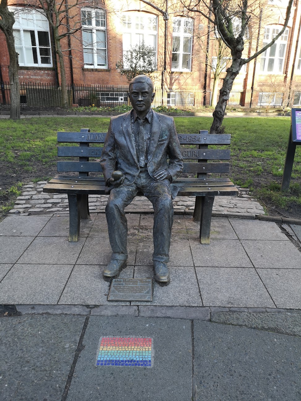 The memorial statue of Alan Turing in Sackville Gardens, Manchester. — MrBauer24, CC BY-SA 4.0 (Wikimedia Commons)