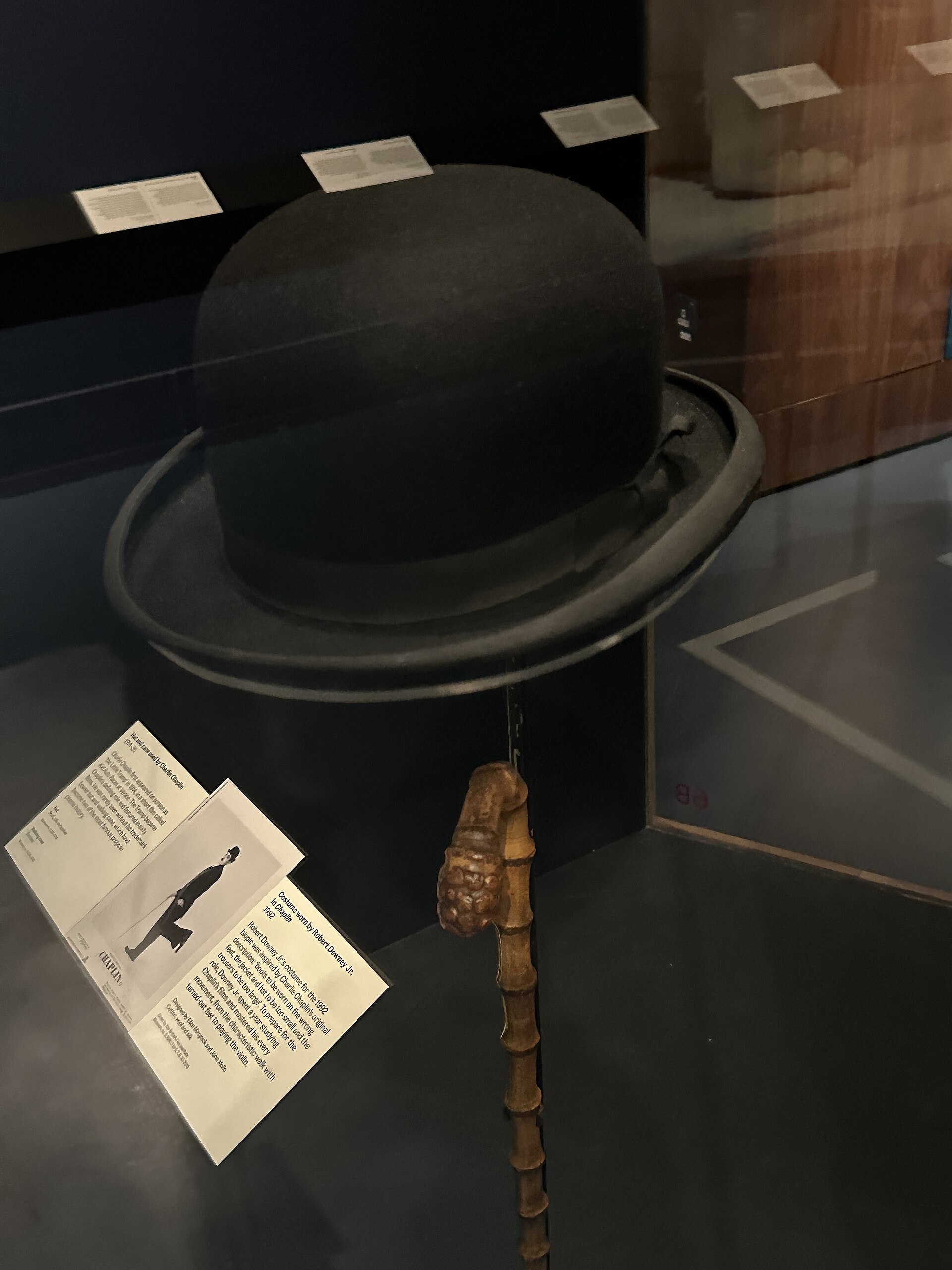 Charlie Chaplin's bowler hat and walking cane, preserved at the V&A museum. — Matt Brown, CC BY 2.0 (Wikimedia Commons)