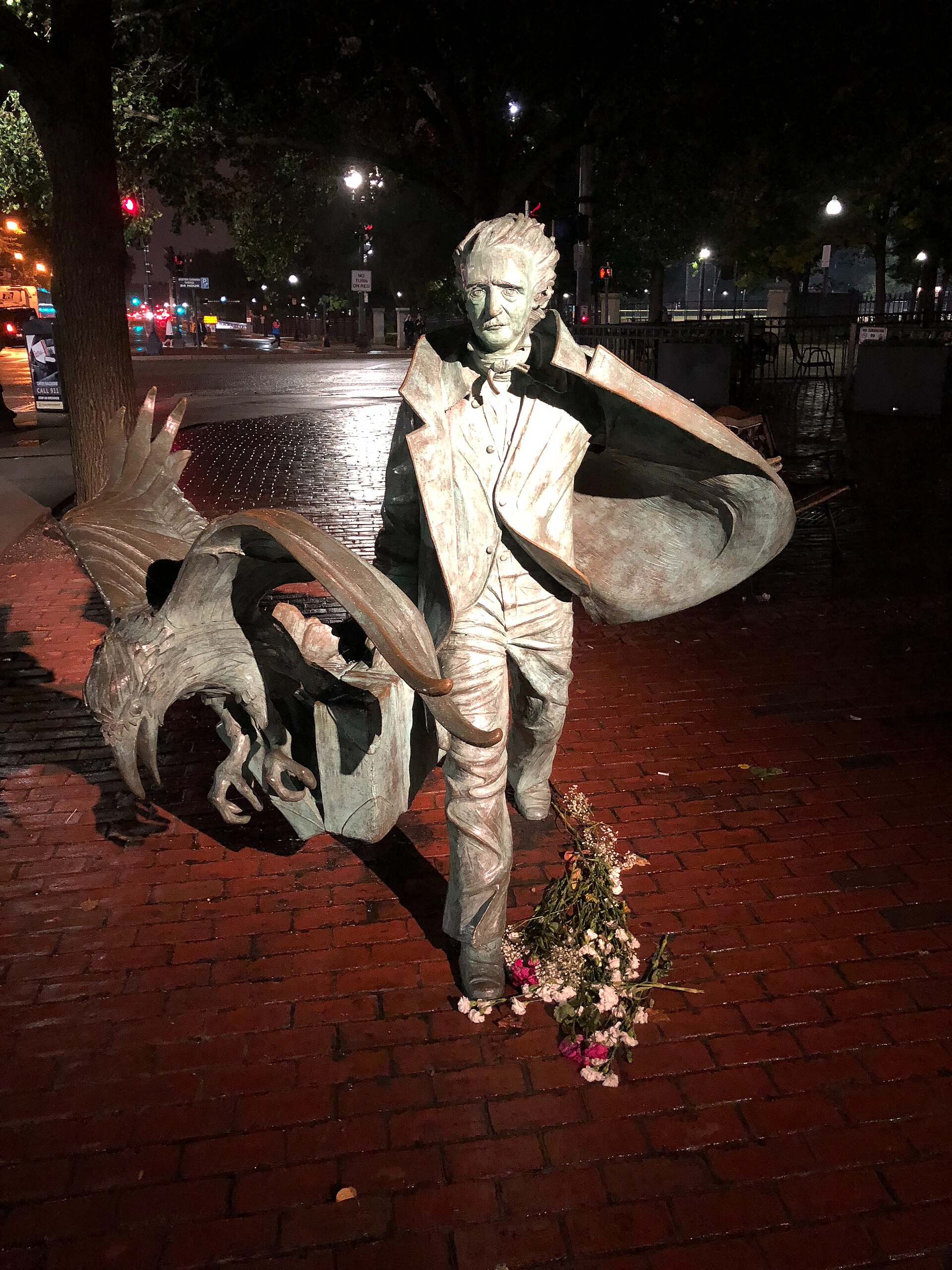 A statue of Edgar Allan Poe with a raven at the corner of Boylston and Charles streets in Boston. — Capvideo, CC BY 4.0 (Wikimedia Commons)
