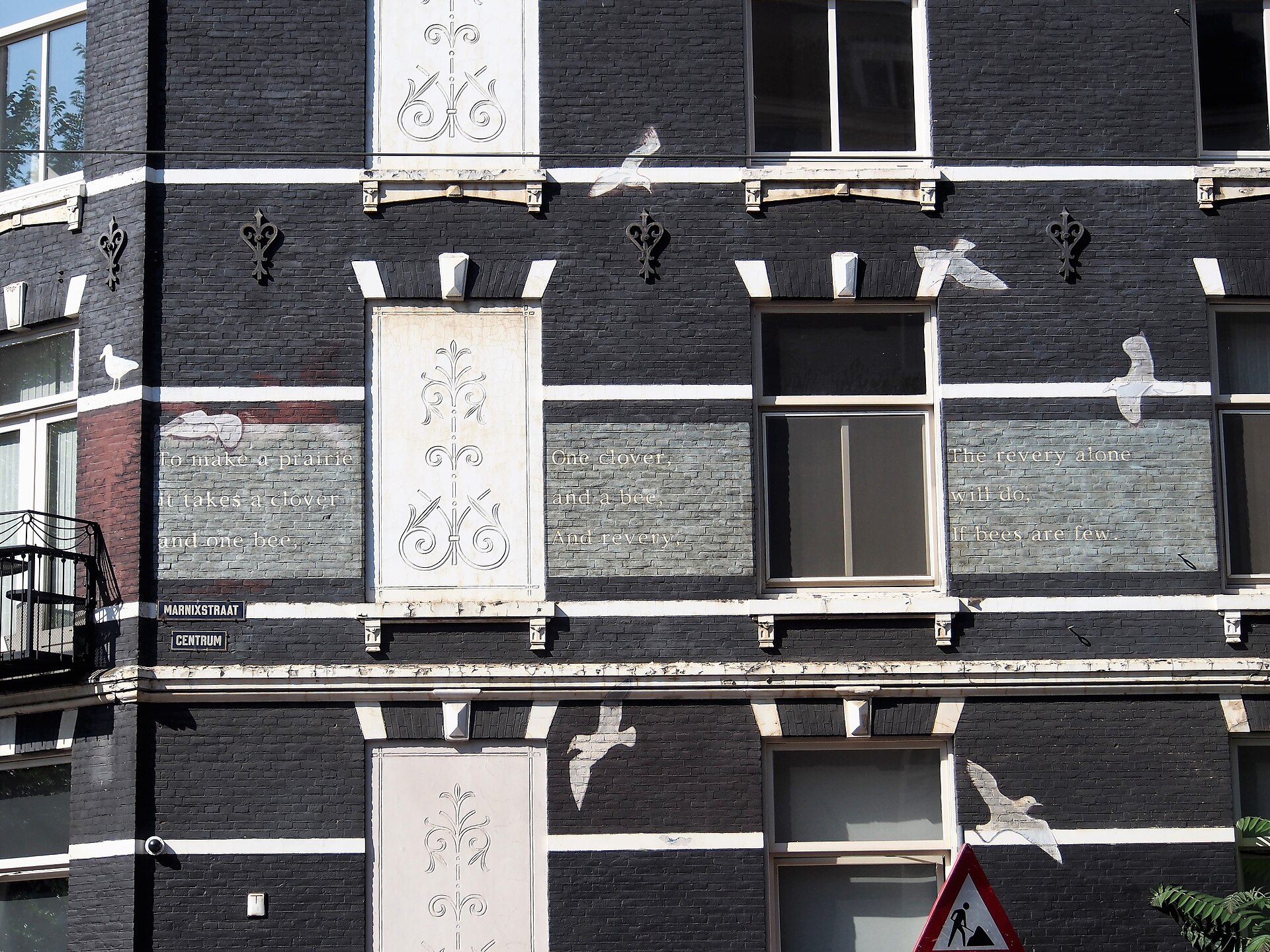 A poem by Emily Dickinson painted on a building at Leidsekade 72 in Amsterdam.