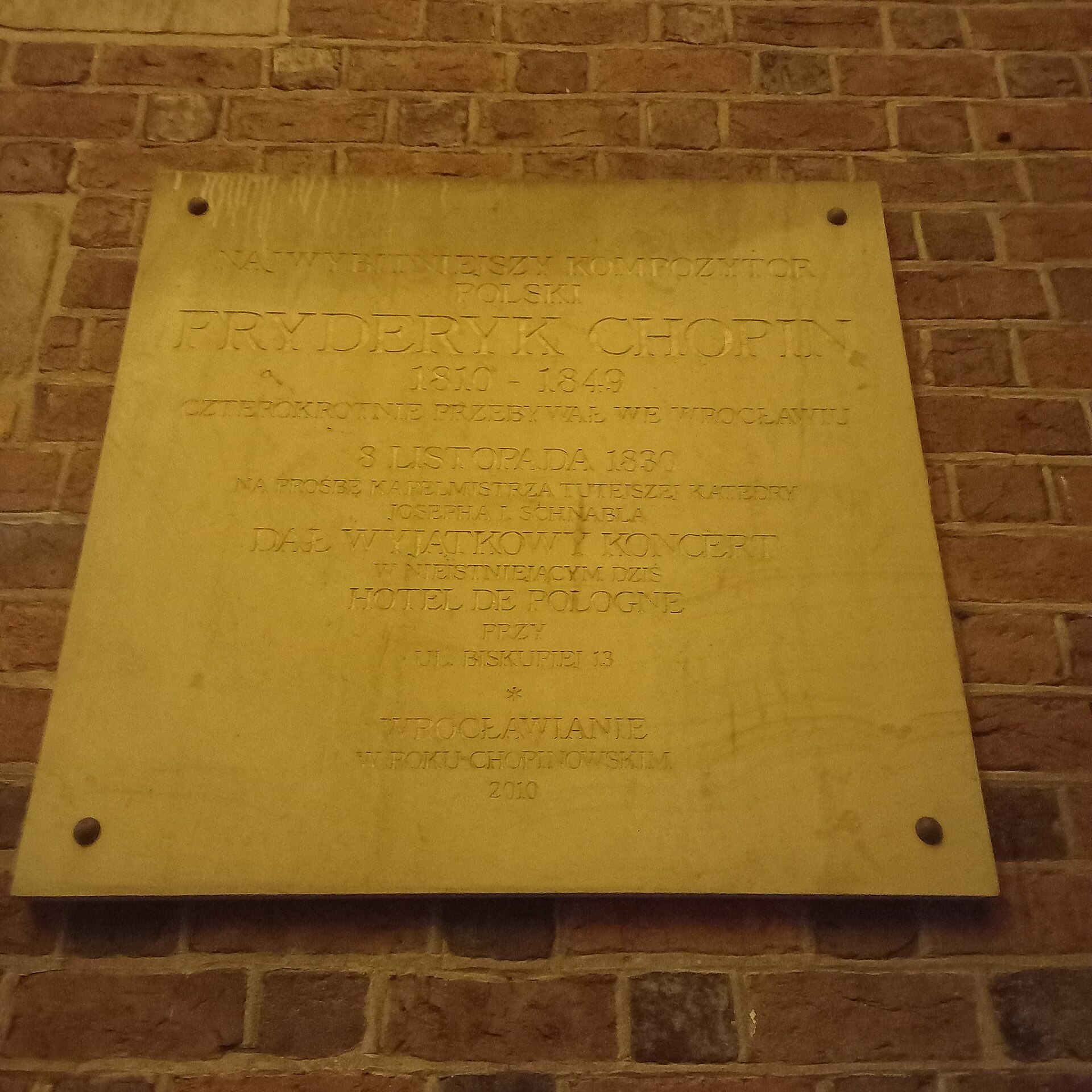 A memorial plaque honouring Frédéric Chopin on the cathedral in Wrocław, Poland.