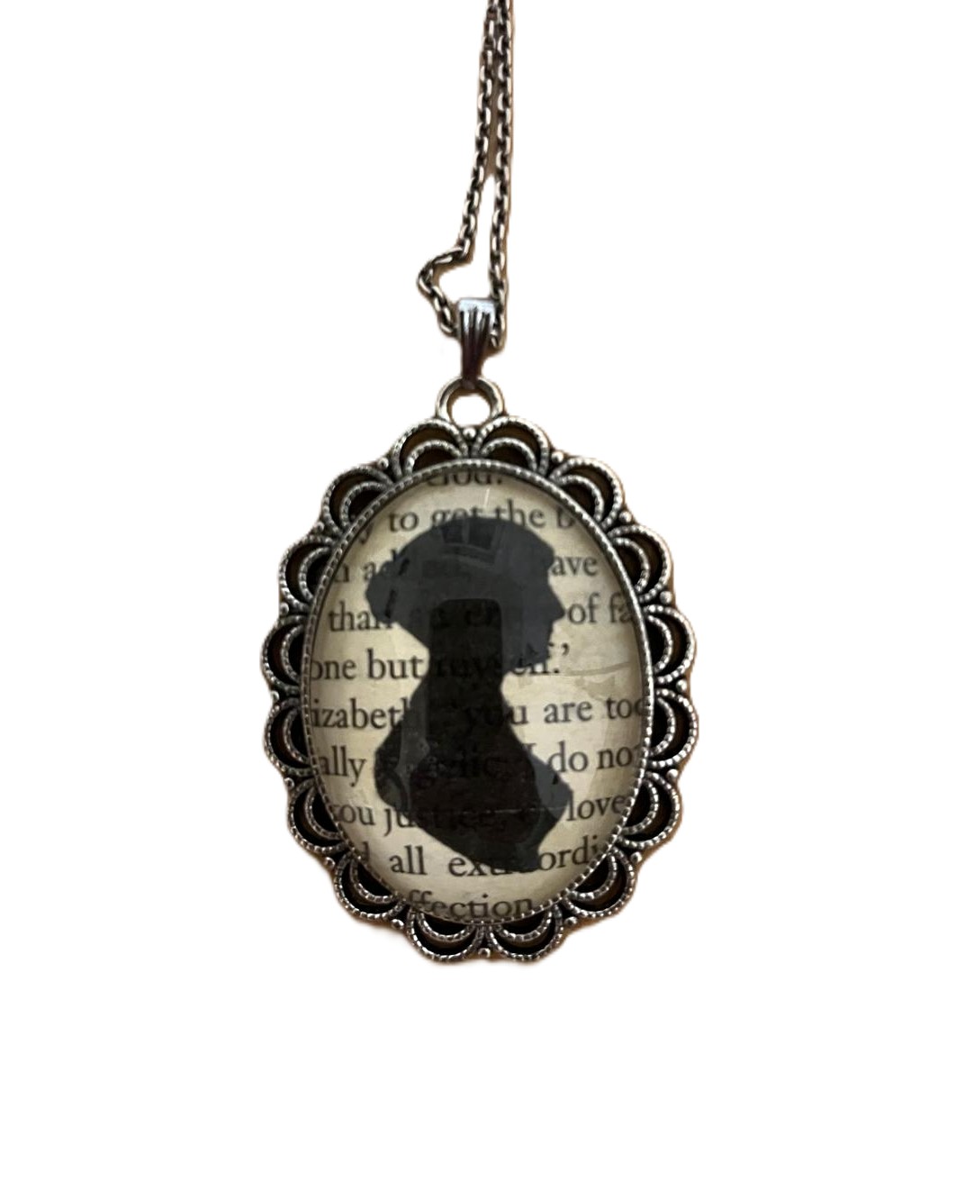 A 19th-century silhouette portrait of Jane Austen set in a pendant. — Dobroš, CC BY-SA 4.0 (Wikimedia Commons)