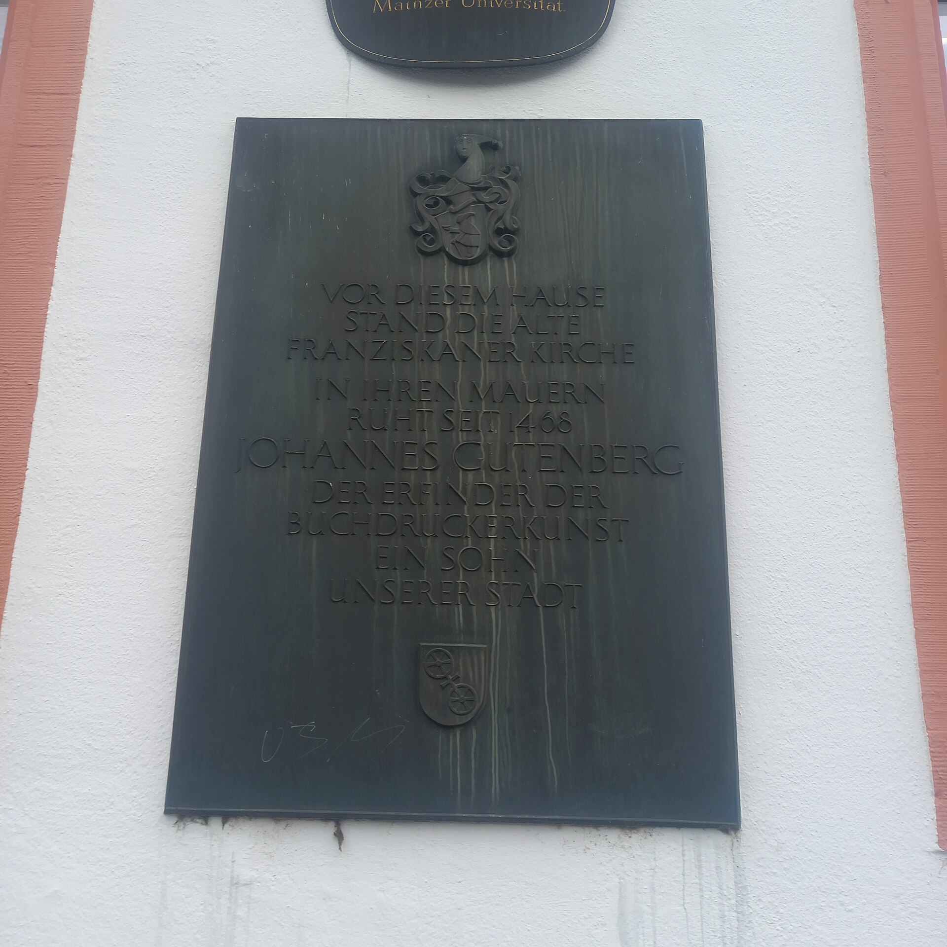 A commemorative plaque marking the former burial place of Johannes Gutenberg in Mainz.