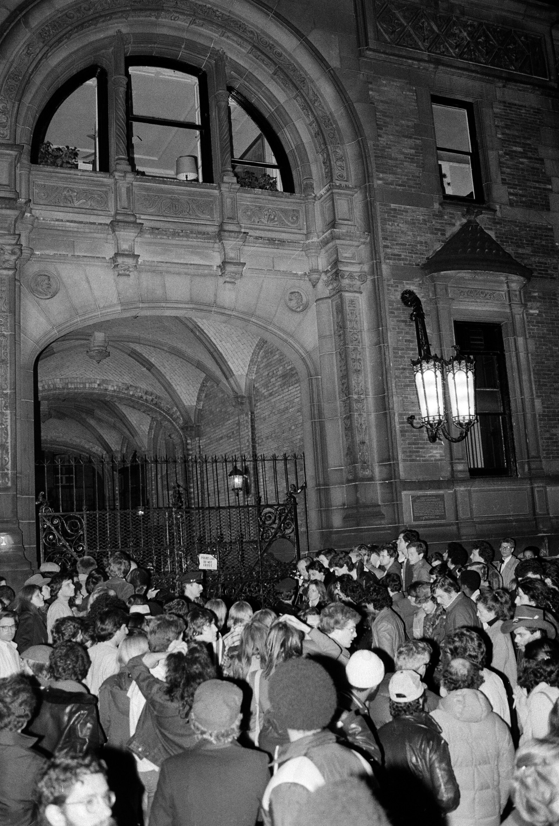 Crowds gather outside the Dakota building in New York after the death of John Lennon in December 1980.