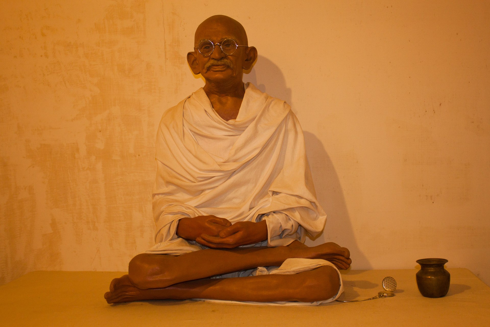 A wax sculpture depicting Mahatma Gandhi. — Navaneeth KN from Bangalore, India, CC BY 2.0 (Wikimedia Commons)