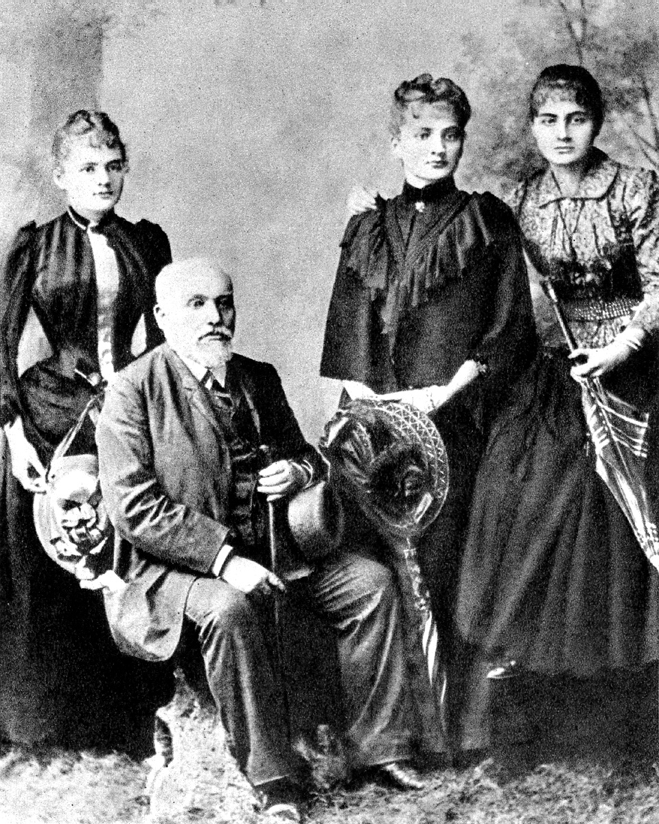 Marie Skłodowska, later Marie Curie, with her father Władysław and her sisters Bronisława and Helena.