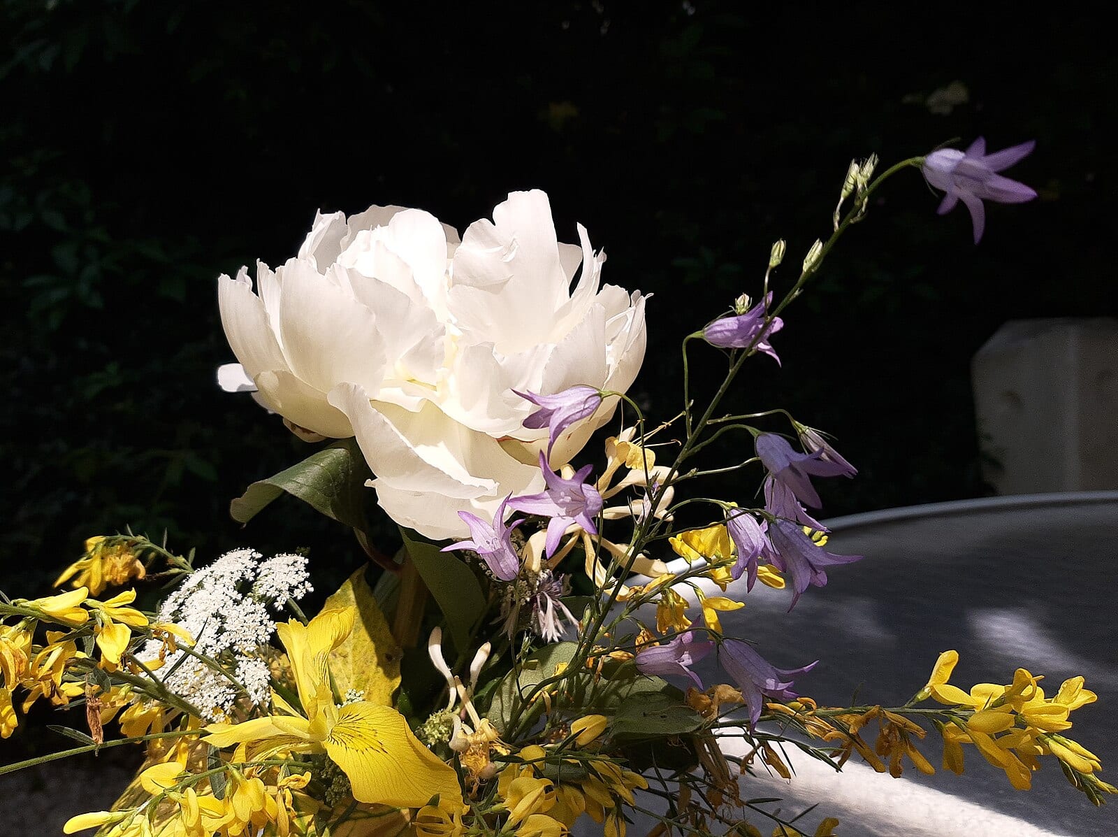 A peony with wildflowers — Anna’s favourite combination for summer bouquets.